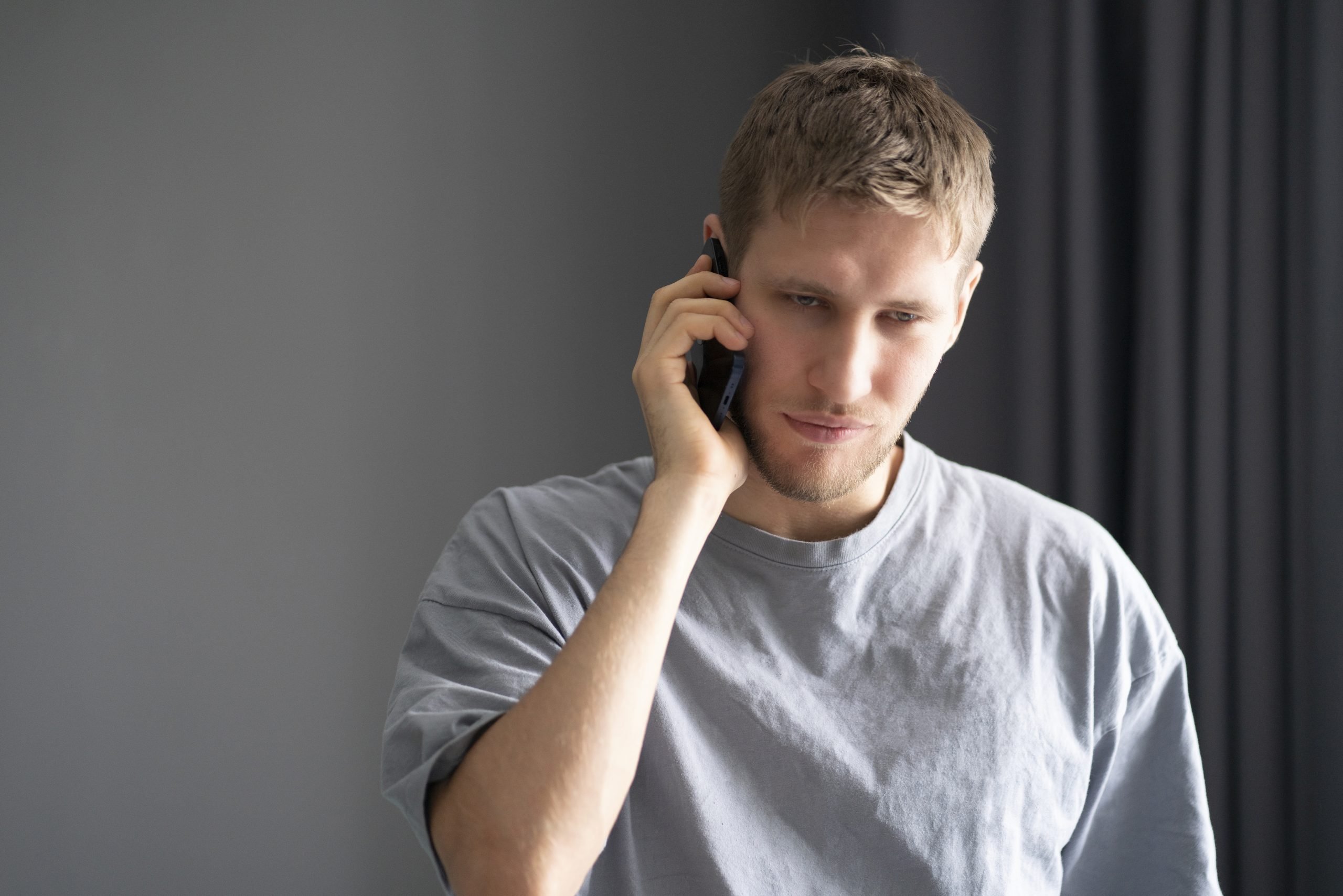a-young-bearded-guy-making-a-phone-call-2023-02-10-09-31-08-utc-scaled
